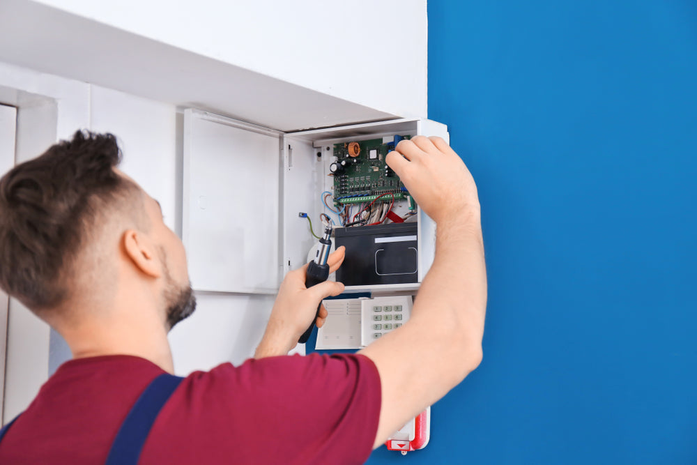 Secure It Controls technician installing a small business access control system in Fort Collins, Colorado.