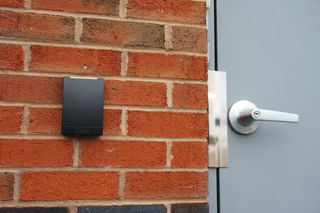 Secure It Controls technician performing access control readers installation in an older commercial building in Fort Collins and Loveland Colorado