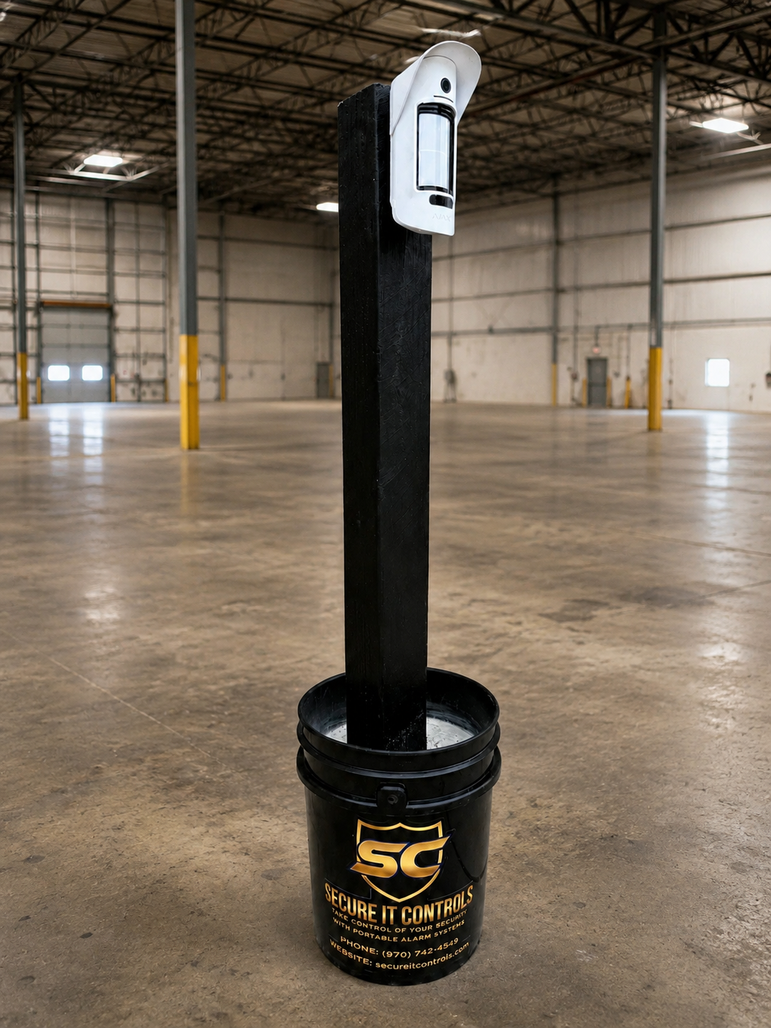 Portable Secure It Controls motion detectors on posts guarding a vacant warehouse