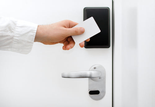 RFID key fob credential unlocking a multi-tenant apartment door installed by Secure It Controls in Northern Colorado