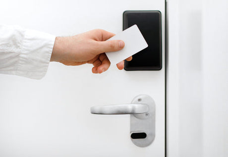 RFID key fob credential unlocking a multi-tenant apartment door installed by Secure It Controls in Northern Colorado